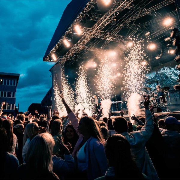 crowd-enjoying-outdoor-concert-with-stage-pyrotech-2026-03-18-08-01-46-utc (1)